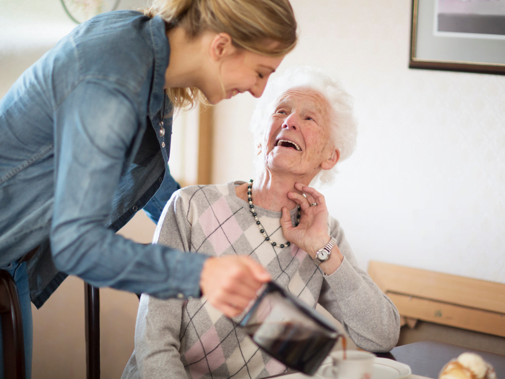 caregiver helping with meal